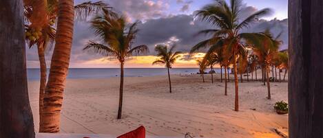 On the beach, sun loungers, beach towels