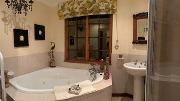 Separate bathtub and shower, jetted bath, free toiletries, hair dryer