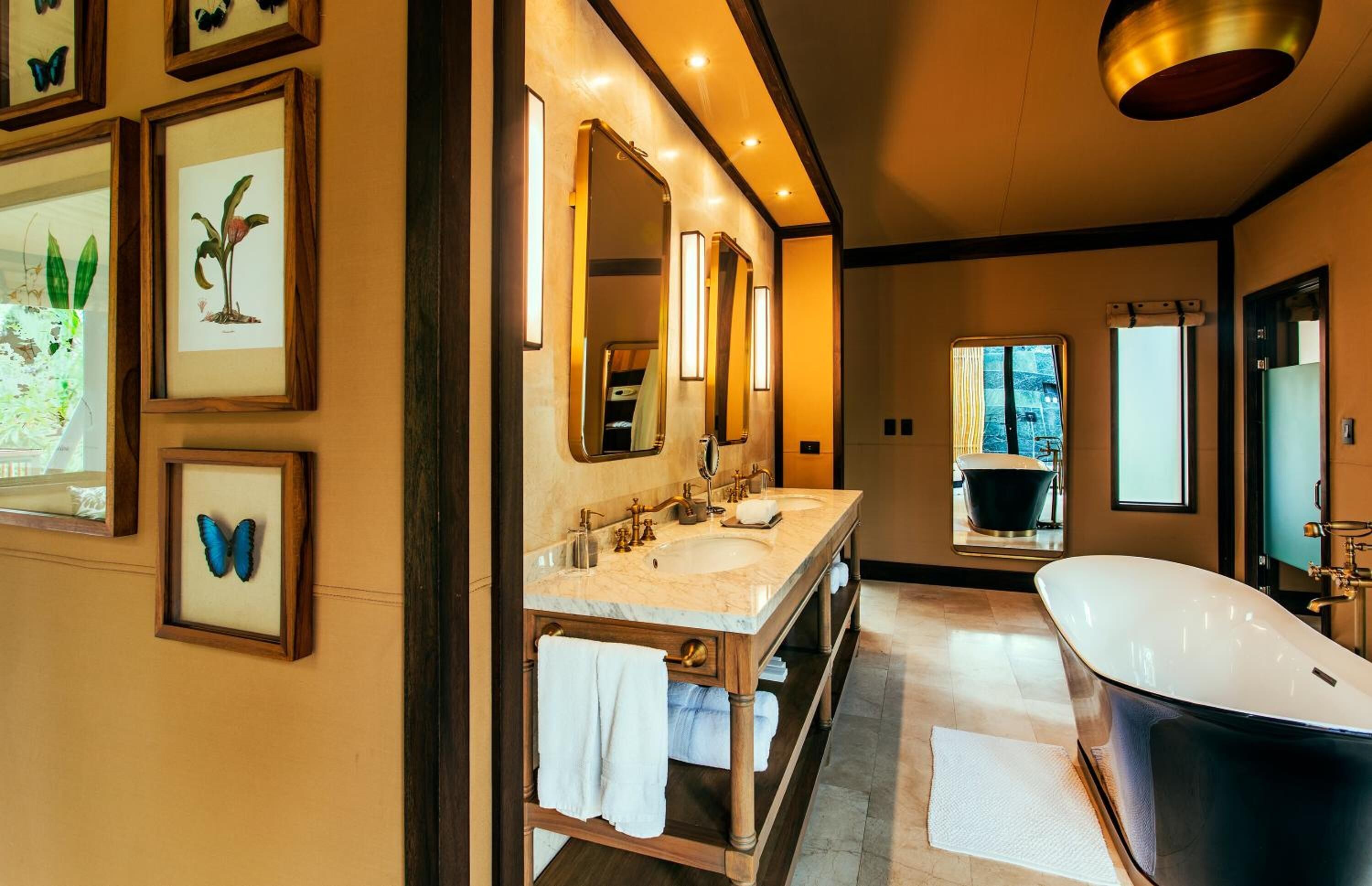 nayara tent | bathroom | combined shower/bathtub, rainfall showerhead, designer toiletries