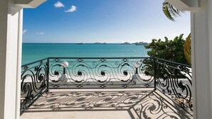 A balcony with ornate black railings and a view of the ocean. - Vittoria (6 bedrooms) - Beachfront villa, Simpson Bay, St. Maarten (Simpson Bay)