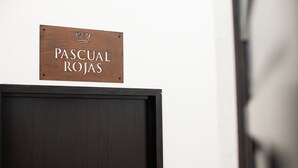 A wooden sign with the text "PASCUAL ROJAS" and a crown symbol. - Hotel Via Real (Atotonilco el Alto)