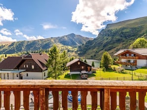 A mountain village with traditional wooden houses, a lake, and a clear sky. - Weissmann by Interhome (Bad Kleinkirchheim)