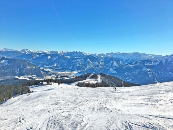 A snow-covered mountain landscape with a clear sky. - Holiday by Interhome (Zell am See)