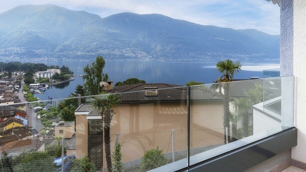 A balcony with a view of a lake and mountains. - Double Room Modern by Interhome (Ascona)