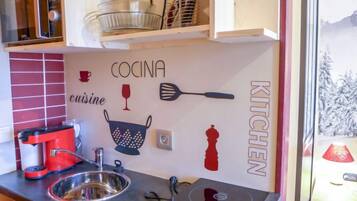 Fridge, microwave, cookware/dishes/utensils