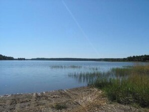 A calm lake with a clear sky.