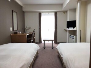 A hotel room with two beds, a desk, a chair, a television, and a window with curtains. - Sapporo Met S (Sapporo)