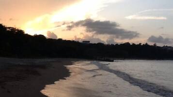 Enjoy serene beach walks along the shoreline, where gentle waves lap at the sandy beach.