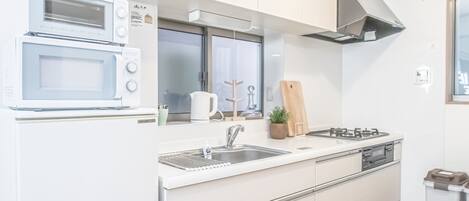 Fridge, microwave, cookware/dishes/utensils