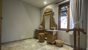 A bathroom with a marble floor, wooden vanity with a mirror, and a window with curtains. - Villa 6# 1BR Stunning Villa w/ Public pool at downtown Ubud (Ubud)