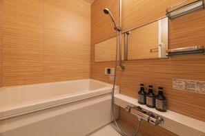 Separate bathtub and shower, free toiletries, hair dryer, slippers