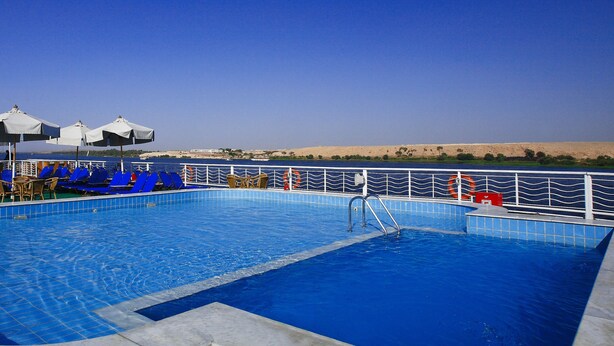 A swimming pool with blue tiles, a metal ladder, and white railings. - JAZ Crown Jubilee Nile Cruise - Every Thursday from Luxor for 07 & 04 Nights - Every Monday from Aswan for 03 Nights (Luxor)