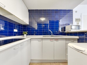 Fridge, microwave, cookware/dishes/utensils