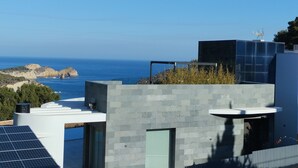 A modern building with a rooftop terrace overlooking a coastal landscape. - Balcon Al Mar by Interhome (Jávea)