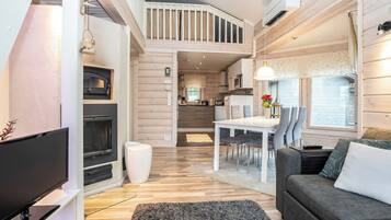 A modern interior with a dining area, kitchen, and living space.