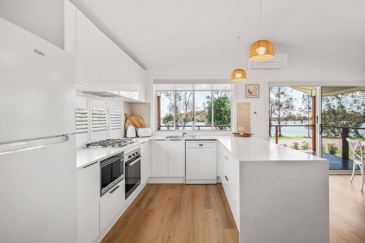 waterfront three bedroom villa | private kitchen | full-sized fridge, microwave, oven, stovetop