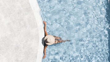 2 outdoor pools, open 8:00 AM to 7:30 PM, pool umbrellas, pool loungers