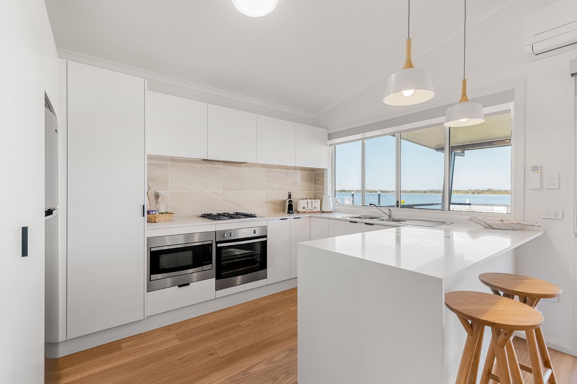 one bedroom waterfront villa | private kitchen | full-sized fridge, microwave, oven, stovetop