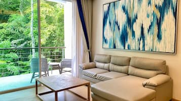 Deluxe Apartment, 2 Bedrooms, Pool View | Living area | TV, DVD player