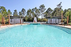 A clear blue pool with lounge chairs and umbrellas, surrounded by trees. - Huge at 2,360 SqFt, Golf Cart & 4 Bikes! 4 WaterColor Pools, Beach Club & Camp - Bess Place on Earth (Santa Rosa Beach)