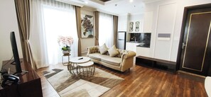 Premium Apartment, 2 Bedrooms | Living area | 40-inch Smart TV with digital channels, TV