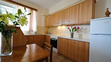 Apartment, Garden View | Private kitchen | Full-sized fridge, oven, stovetop, electric kettle