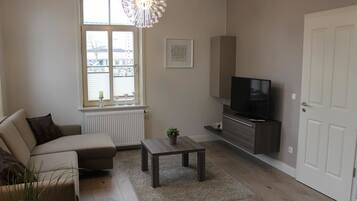 Apartment (Lütje Hörn) | Living area | Flat-screen TV, DVD player, table tennis