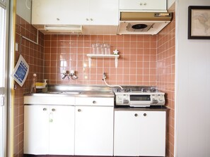 Apartment | Private kitchenette | Full-size fridge, microwave, stovetop, coffee/tea maker
