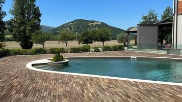 Seasonal outdoor pool, pool umbrellas, sun loungers