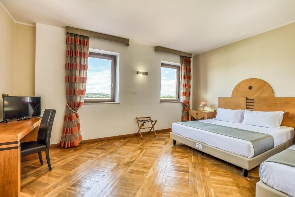 Chambre Quadruple Confort | Draps italiens Frette, literie de qualité supérieure