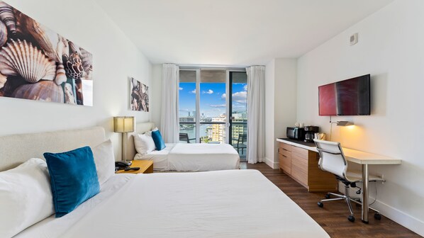 Enjoy a comfortable stay in this stylish room with a large bed, desk, and city view.