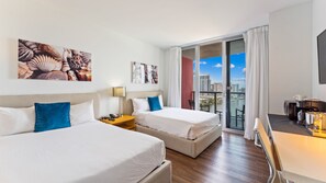 Enjoy city views from the comfort of this room, featuring two single beds and a convenient desk area with a coffee maker.