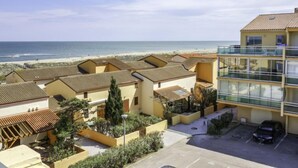 A coastal residential area with a view of the beach.