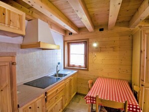 Fridge, cookware/dishes/utensils, dining tables - Albergo Diffuso - Cjasa de Barce by Interhome (Barcis Lake)