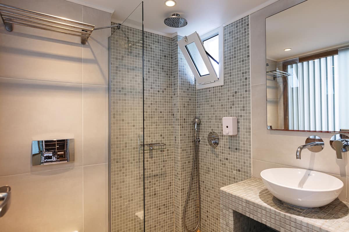 superior room with garden or mountain view | bathroom | rainfall showerhead, hair dryer, towels