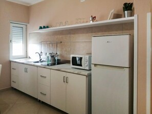 Fridge, microwave, cookware/dishes/utensils