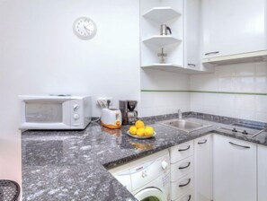 Fridge, microwave, cookware/dishes/utensils