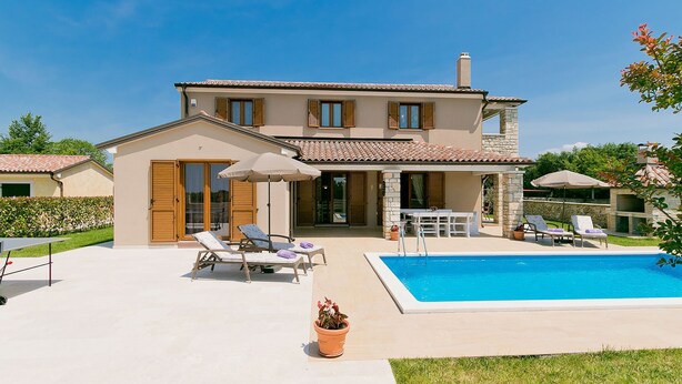 A two-story house with a swimming pool, outdoor seating, and a patio area. - Vacation home Angela by Interhome (Poreč/Sv. Lovreč)