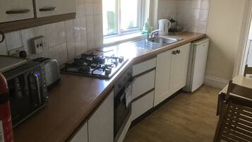 Maritime Apartment- (Ground Floor) | Private kitchen | Fridge, microwave, oven, stovetop