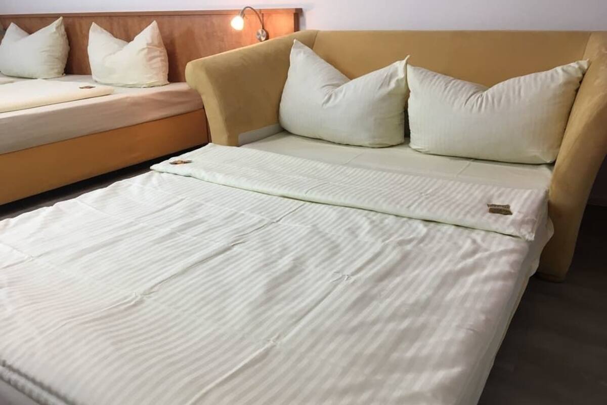 family room | 1 bedroom, in-room safe, desk, iron/ironing board