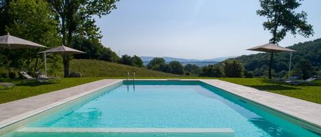 Seasonal outdoor pool, open 9:00 AM to 7:00 PM, sun loungers