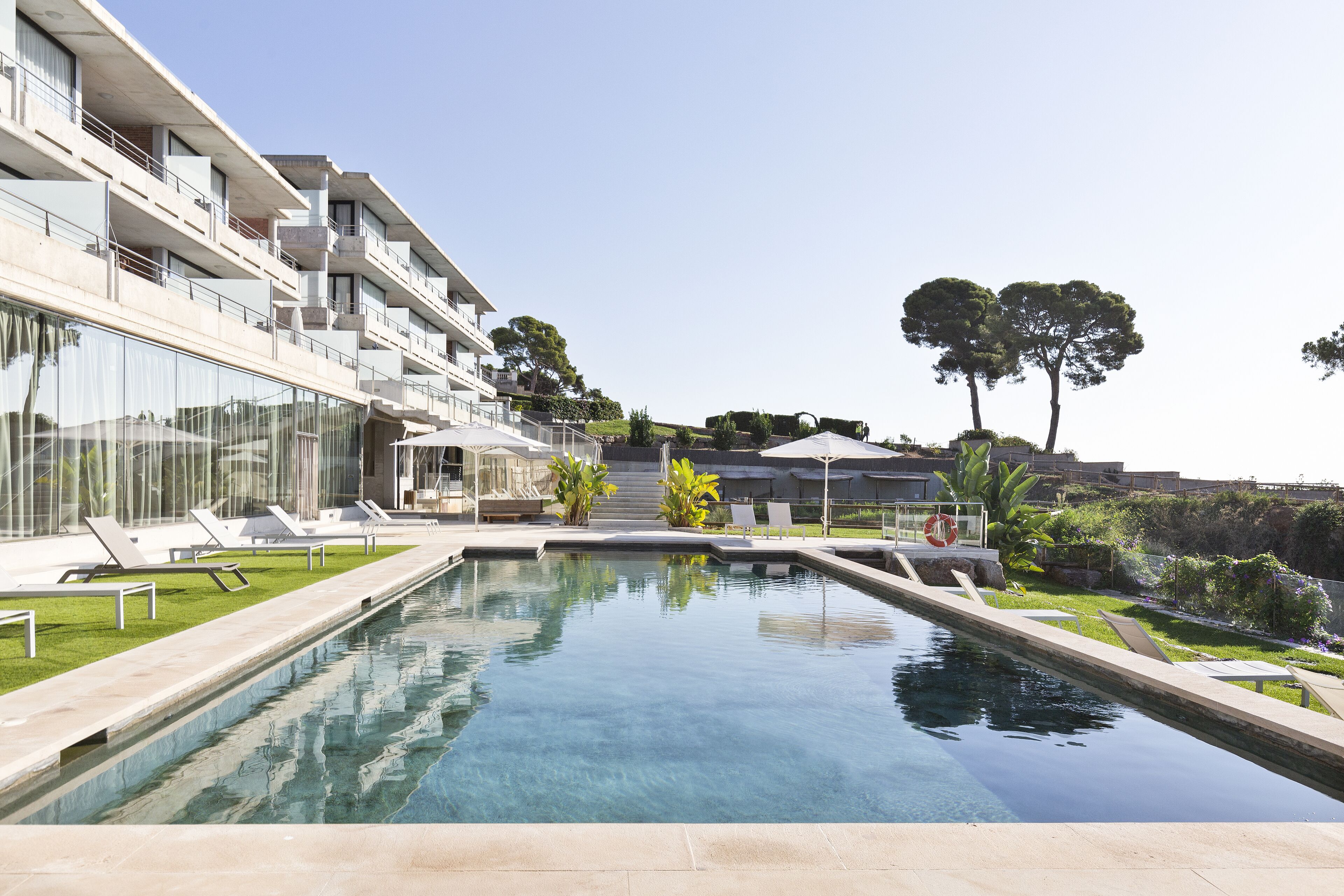 Outdoor pool, open 9:00 AM to 9:00 PM, pool umbrellas, pool loungers