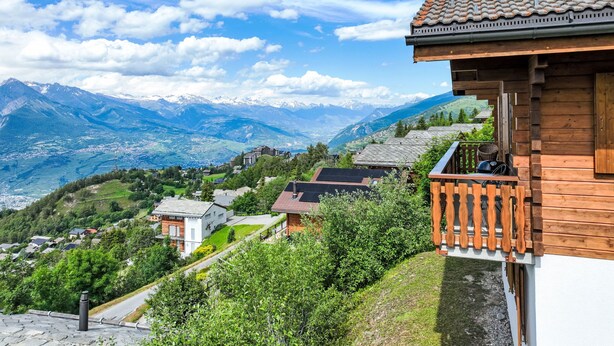 A wooden chalet with a balcony overlooking a mountainous landscape. - Vacation home Lara by Interhome (Nendaz)