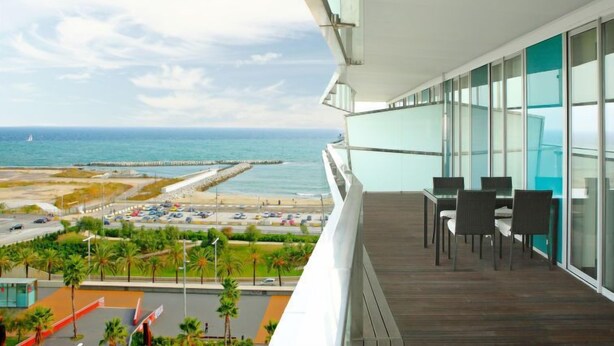 A balcony with a view of the beach and ocean. - Diagonal Mar by Interhome (Barcelona)