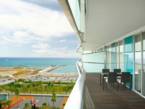 A balcony with a view of the beach and ocean. - Diagonal Mar by Interhome (Barcelona)