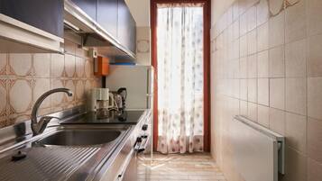 Fridge, oven, highchair, cookware/dishes/utensils