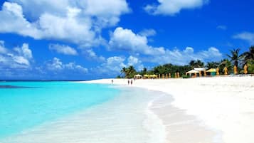 On the beach, sun-loungers, beach towels