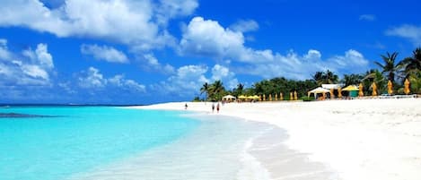 On the beach, sun-loungers, beach towels