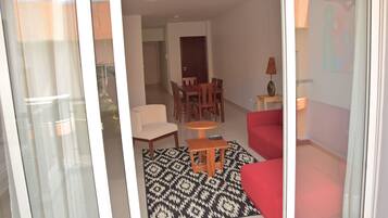 Apartment, 3 Bedrooms | Living area | Flat-screen TV