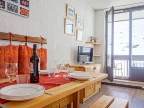 Enjoy a romantic dinner for two in this stylish dining area with a flat-screen TV and a view of the outdoors.
